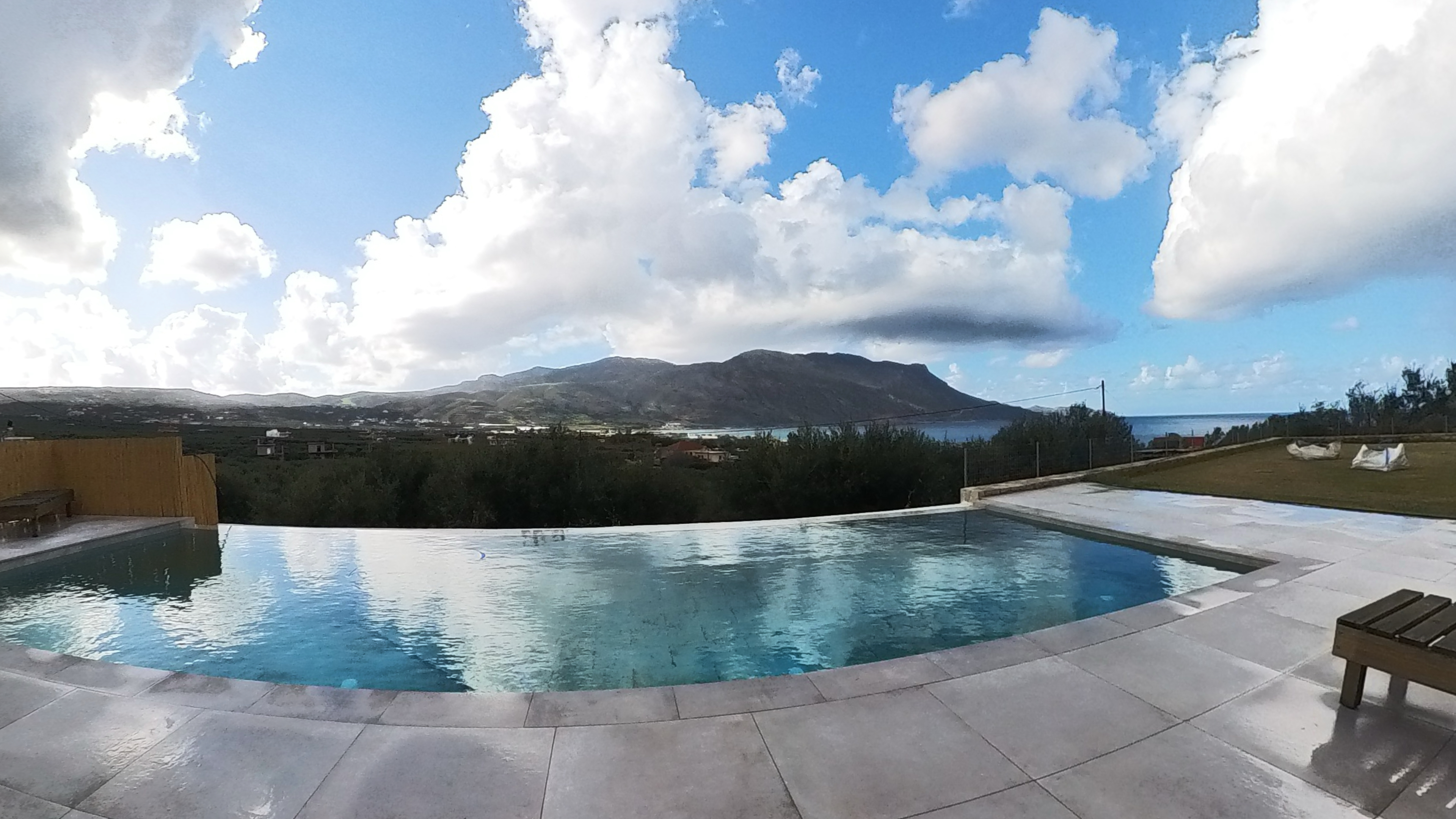 Pool terrace at Nusa retreat with sea view
